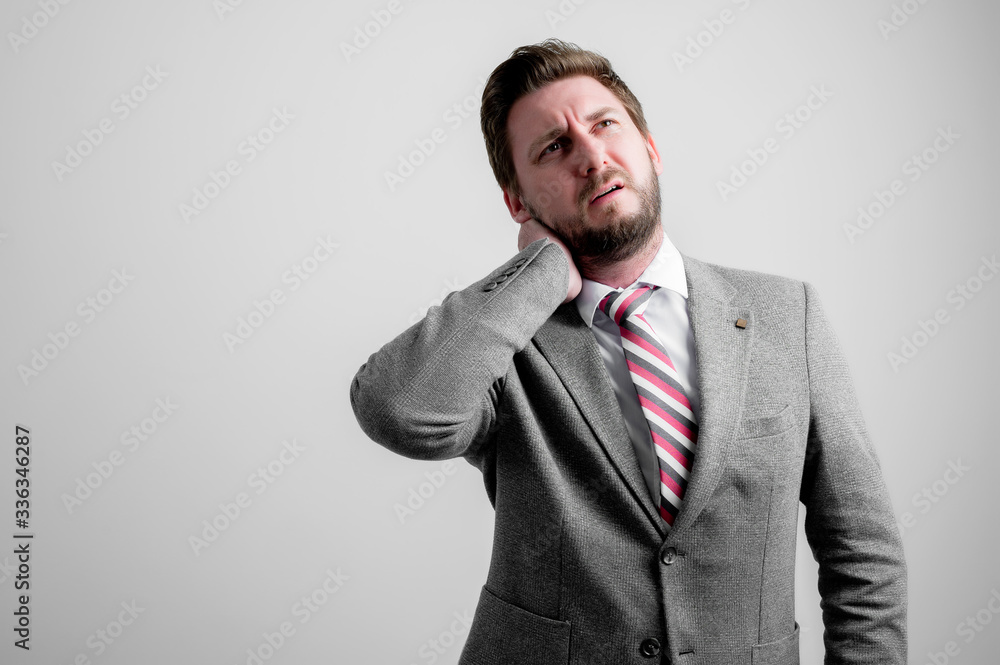 Portrait of business man wearing business clothes gesturing neck ache Portrait of business man wearing business clothes gesturing neck ache