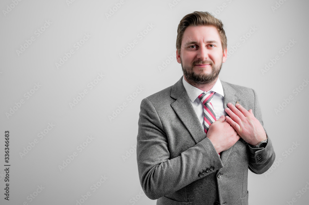 Portrait of business man wearing business clothes keep hands near heart Portrait of business man wearing business clothes keep hands near heart