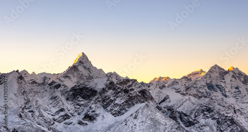 Sunrise above himalayan peaks. Cover sized photo. Beautiful high mountains landscape.