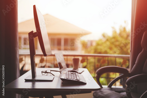 Work from Home Concept, Working table at Home with Computer Monitor and Laptop Computer