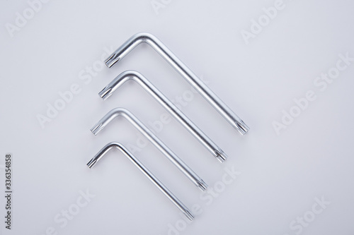 Four steel tools  assembling and assembling furniture on a white background