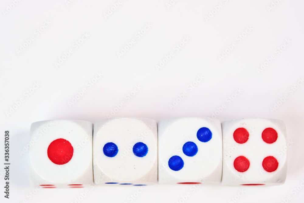 Four dice, cubes on a white background, space for text Four dice, cubes on a white background, space for text