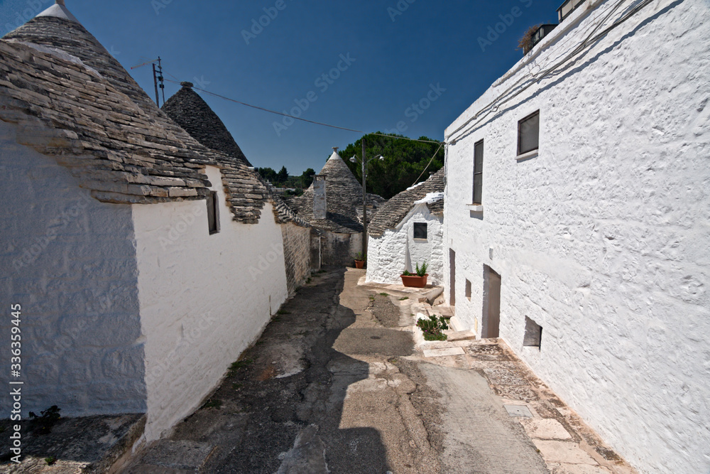 Panoramic view of the streets with the characteristic trulli of the town of Alberobello in Puglia, Italy.