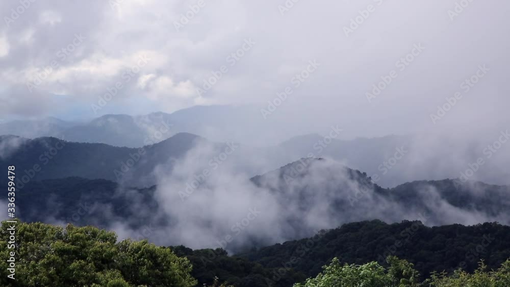 The green mountains and the fog is moving through Time lapse The green mountains and the fog is moving through Time lapse