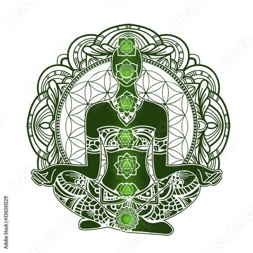 Ornate silhouette with chakras meditating in lotus position on the background of the mandala. Yoga position