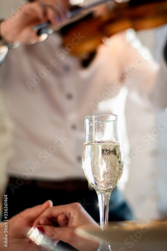 Date to the sounds of a violin. A wonderful meeting with your beloved. Glass of champagne and violin sounds