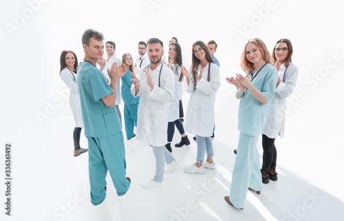 team of diverse doctors applauding their joint success