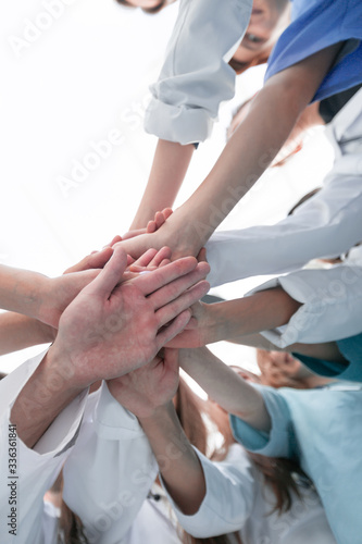 bottom view. group of diverse doctors showing their unity
