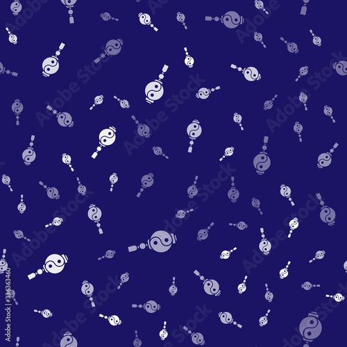 White Yin Yang symbol of harmony and balance icon isolated seamless pattern on blue background. Vector Illustration