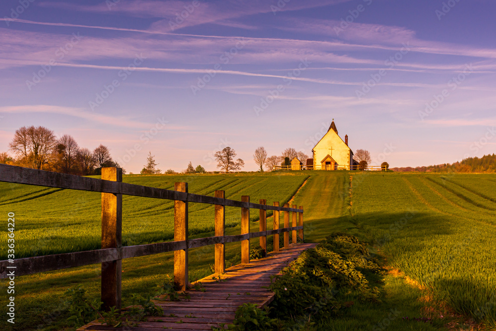 Boardwalk leading to the Isolated St Hubert's Church, South Downs National Park