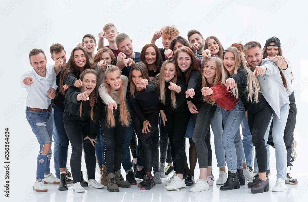 group of happy young people pointing at you
