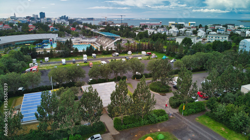 Aerial view of Reykjavik. Sports area with swimming pools, camping sites, footballs, caravans and hostels. Views of the mountains and the bay