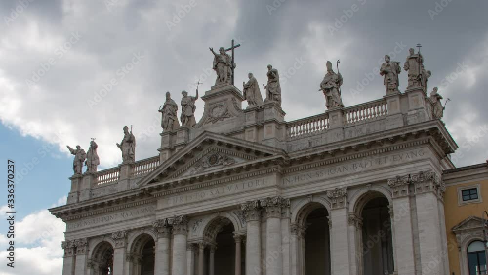 Basilica di San Giovanni in Laterano low angle with clouds above close up. Basilica di San Giovanni in Laterano low angle with clouds above close up.