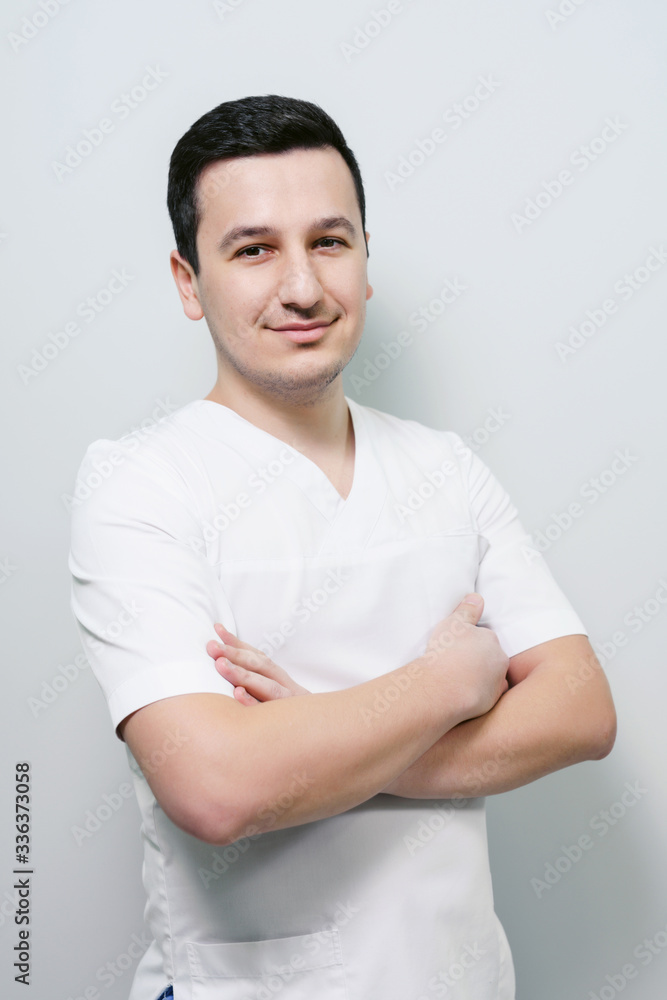 Portrait of young friendly medical doctor isolated over white background Portrait of young friendly medical doctor isolated over white background