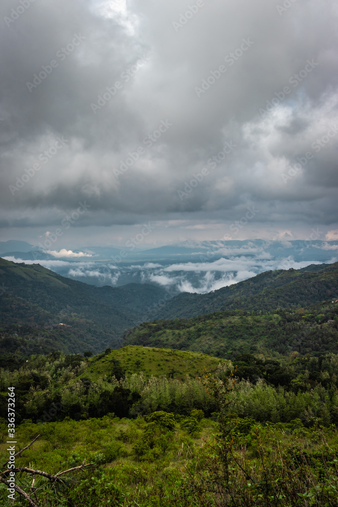 Fototapeta premium mountain coverd with cloud layers and beautiful sky