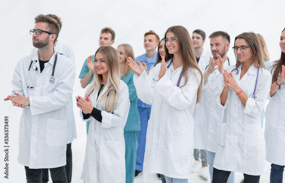close up. hospital doctors applauding their success. close up. hospital doctors applauding their success.