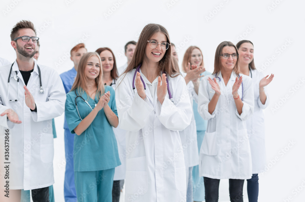 group of young doctors give a standing ovation group of young doctors give a standing ovation
