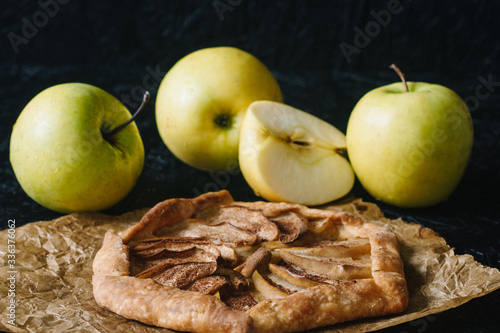 Gallet with apples on a black background. Seasonal dishes. Diet Baking photo