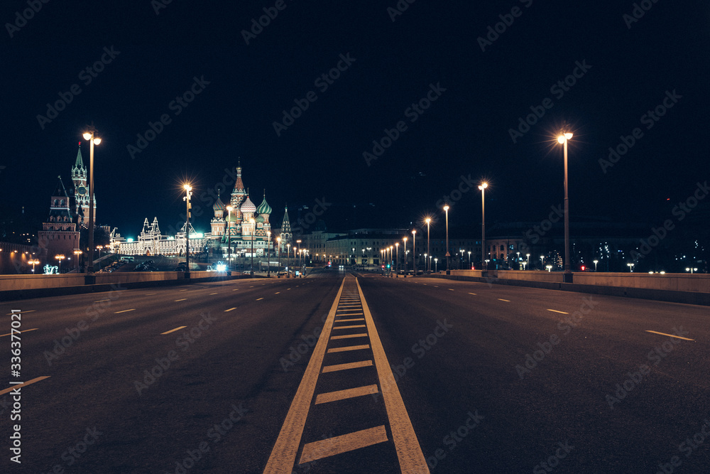 Moscow, Russia - Red square view of St. Basil's Cathedral in the night, the Red square and the bridge are empty due to a quarantine. Moscow, Russia - Red square view of St. Basil's Cathedral in the night, the Red square and the bridge are empty due to a quarantine.