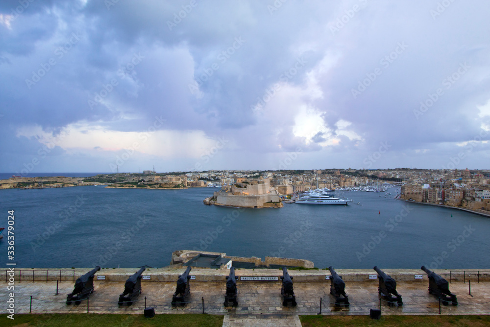 The 16th century Saluting Battery at the lower tier of St. Peter & Paul Bastion overlooking Fort St. Angelo and the Grand Harbour in Valletta, Malta