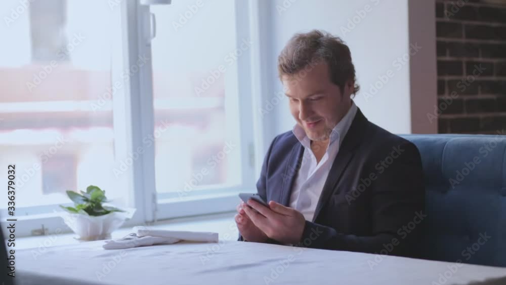 Portrait of businessman using smartphone in restaurant Portrait of businessman using smartphone in restaurant