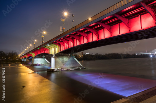 Obraz na płótnie Modern illuminated bridge in Warsaw - capital of Poland. Boulevards on the Vistula river. w salonie