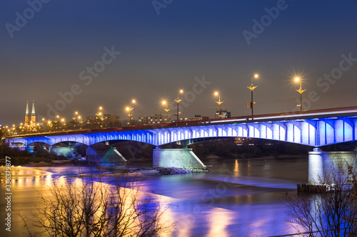 Obraz na płótnie Modern illuminated bridge in Warsaw - capital of Poland. Boulevards on the Vistula river. w salonie
