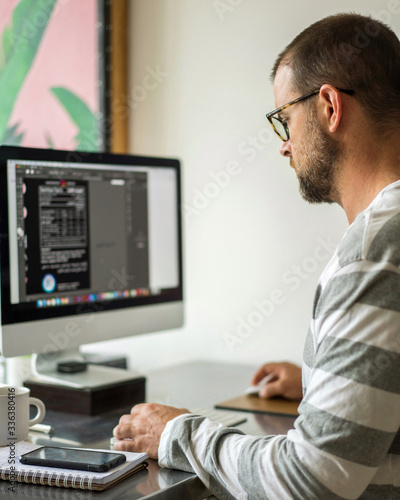 Man working on a computer from home