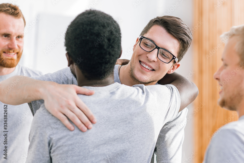 two happy student friends hugging each other two happy student friends hugging each other