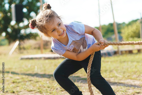pretty girl pulling rope