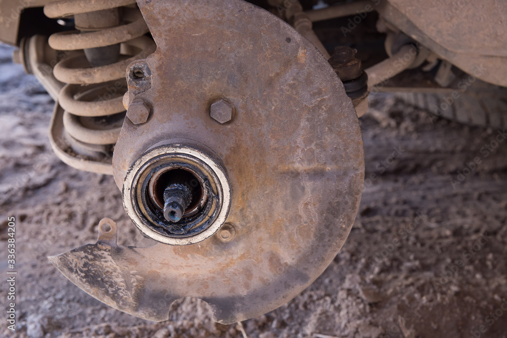 The hub of the car. The front suspension spring of the car. Front wheel drive car. Car repair, breakdown on the road.