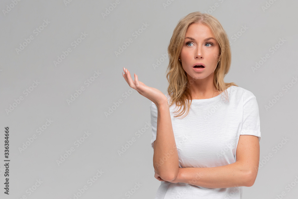What wrong. Ambushed shocked confused young girl coworker shrugging hands spread sideways full disbelief asking question questioned perplexed understood situation, white background What wrong. Ambushed shocked confused young girl coworker shrugging hands spread sideways full disbelief asking question questioned perplexed understood situation, white background