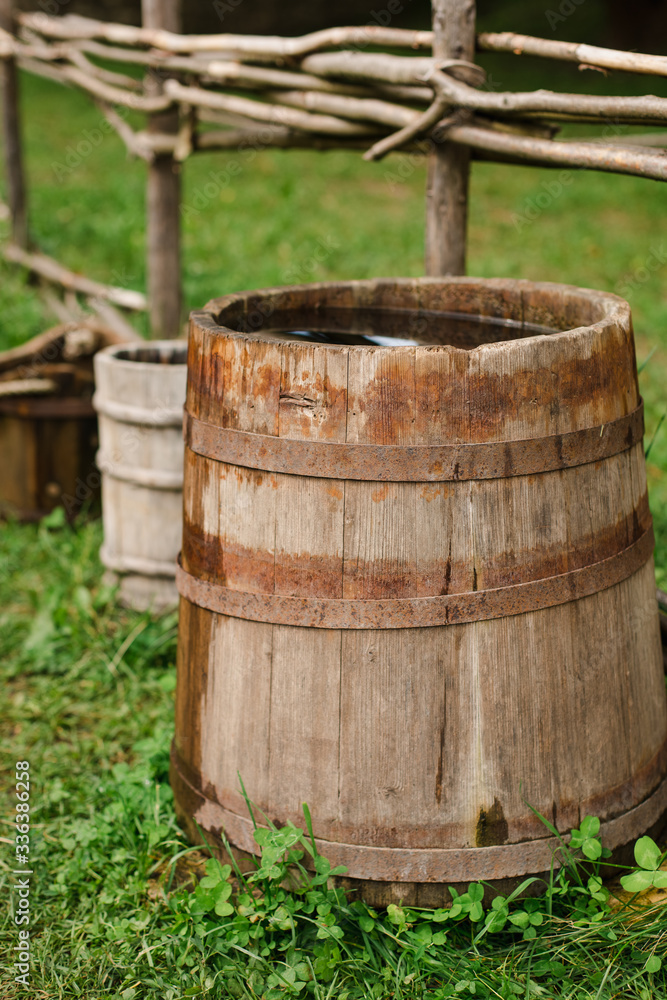 water barrels in the garden on the grass. water barrels in the garden on the grass.