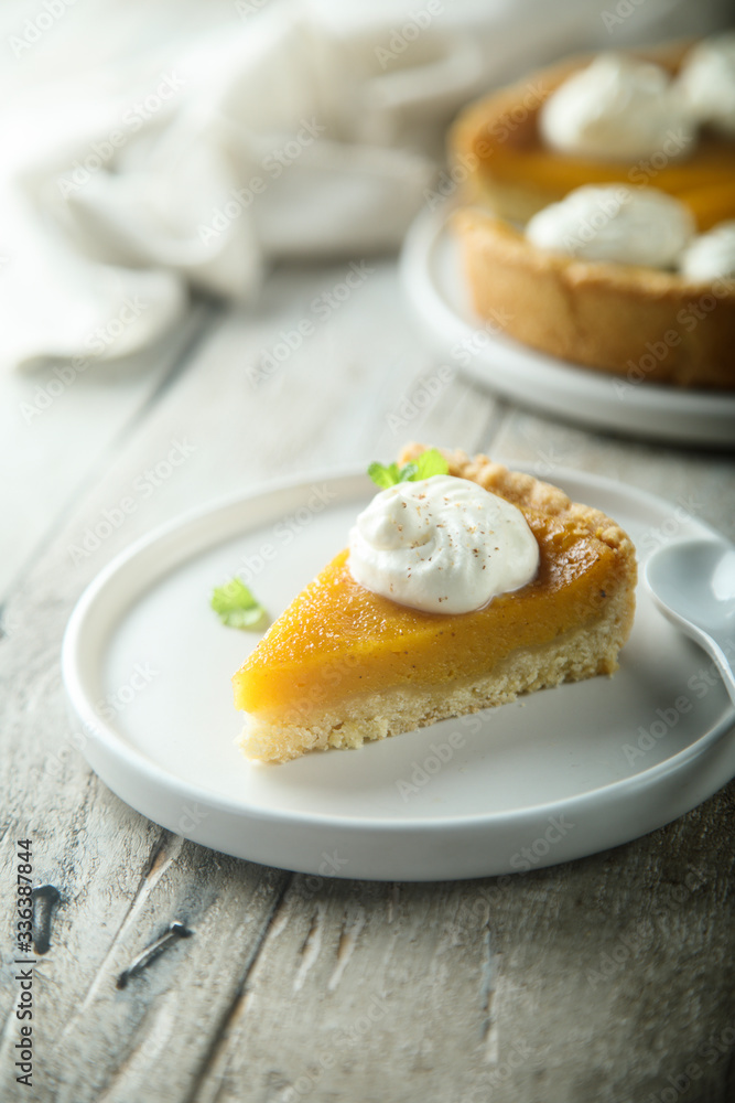 Homemade pumpkin pie with whipped cream Homemade pumpkin pie with whipped cream