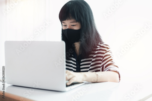 Woman wearing a black face ...