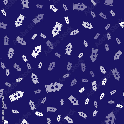 White Condom safe sex icon isolated seamless pattern on blue background. Safe love symbol. Contraceptive method for male. Vector Illustration