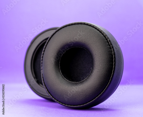 earpads on purple background front view photo