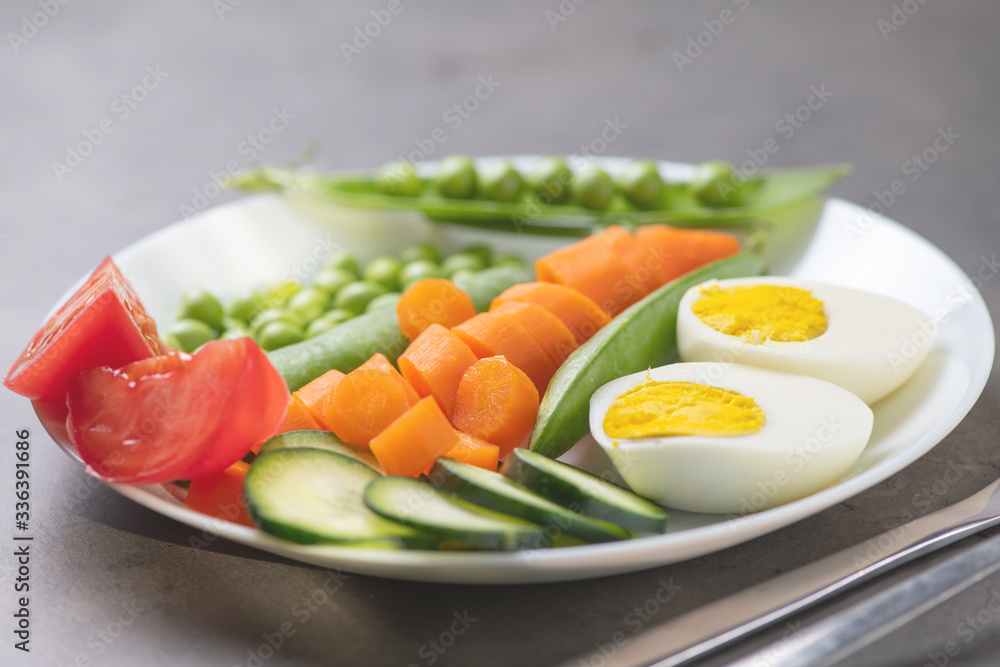 fresh vegetables and egg on a white plate fresh vegetables and egg on a white plate