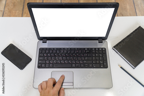 Wroking from home concept with hands typing on a laptop