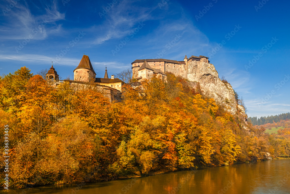 The medieval Orava Castle over a river at autumn, Slovakia, Europe.