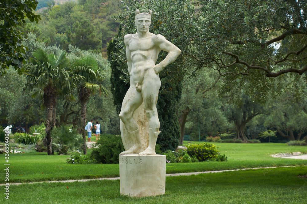 White marble statue from Greek mythology. Beautiful woman in Aivazovsky landscape park (Park Paradise) in Partenit. ALUSHTA - AUGUST 4, 2016