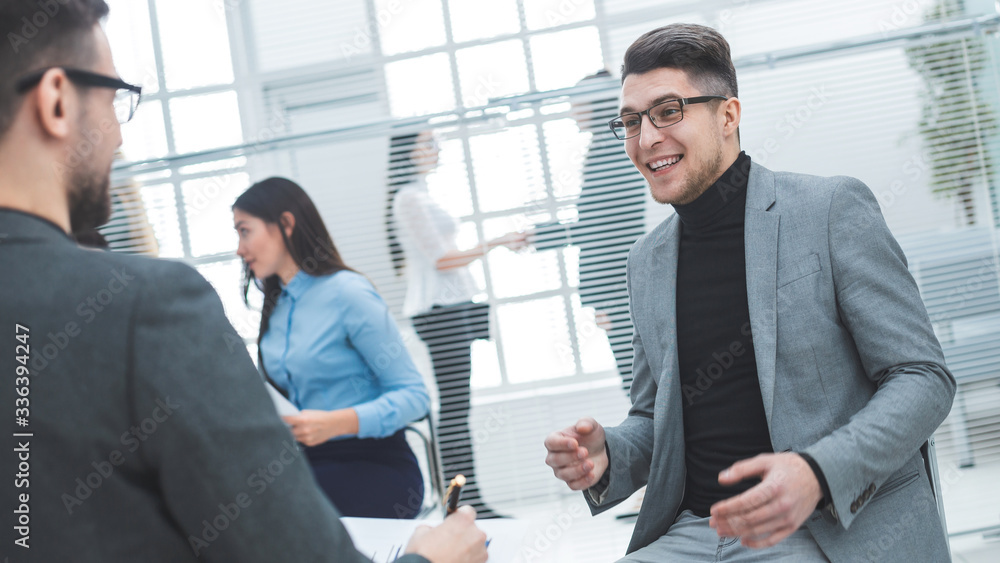 young businessman discussing with a colleague his ideas young businessman discussing with a colleague his ideas