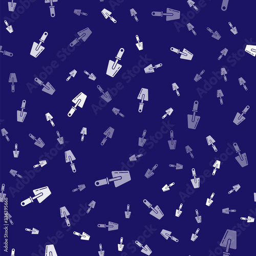 White Trowel icon isolated seamless pattern on blue background. Vector Illustration