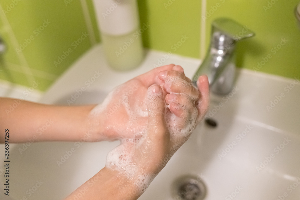 Boy is washing hands rubbing with soap for coronavirus prevention, hygiene to stop spreading coronavirus Boy is washing hands rubbing with soap for coronavirus prevention, hygiene to stop spreading coronavirus
