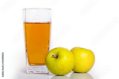 glass of apple juice and apples