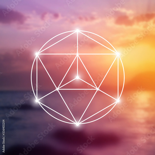 Merkaba sacred geometry spiritual new age futuristic illustration with interlocking circles, triangles and glowing particles in front of blurry natural photographic background