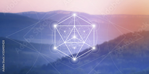 Merkaba sacred geometry spiritual new age futuristic illustration with interlocking circles, triangles and glowing particles in front of blurry natural photographic background