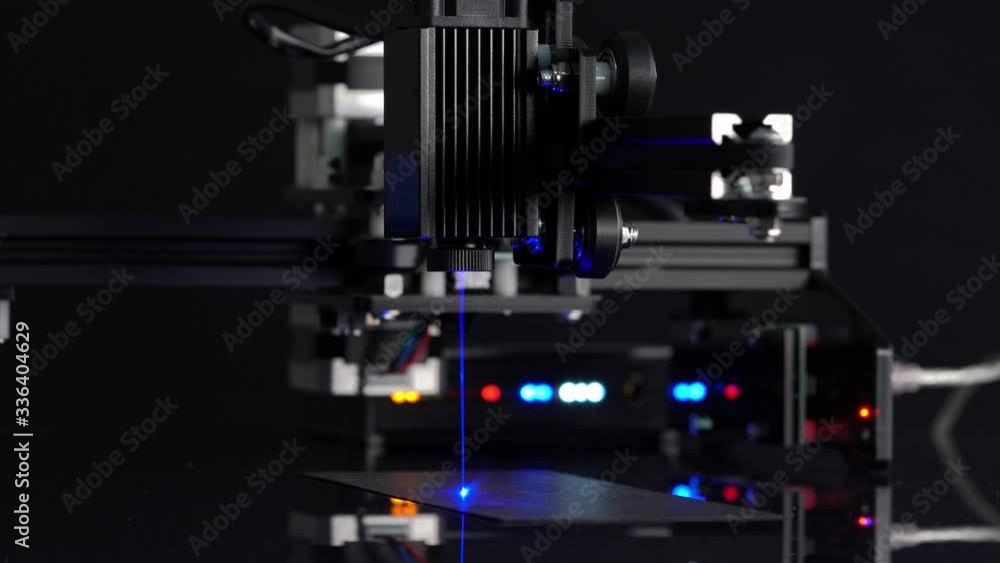 Modern Laser Cutting CNC tool. Automation High precision laser manufacturing of parts. Close up computer cnc on dark background.