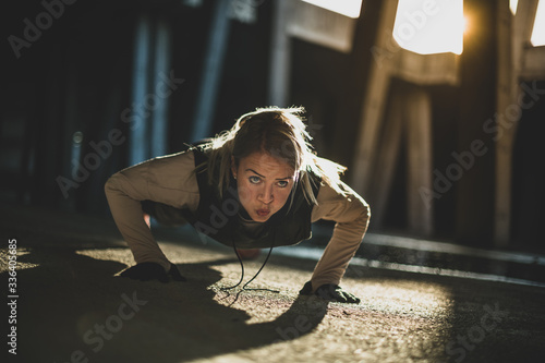 Close up of a young Caucasian woman doing push ups