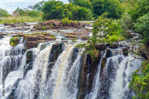 Panorama view with dramatic waterfall and clouds at Victoria Falls  Zimbabwe  Zambia.